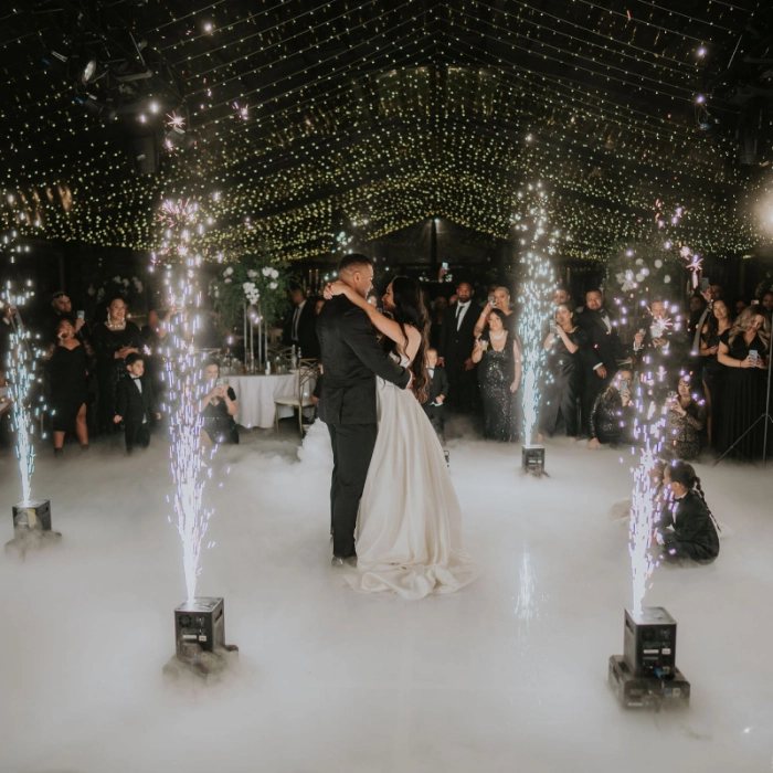 A first dance in The Pavilion between sparkler fountains and low fog